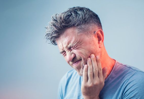 man whose mouth hurts because of a failed dental implant in Houston 